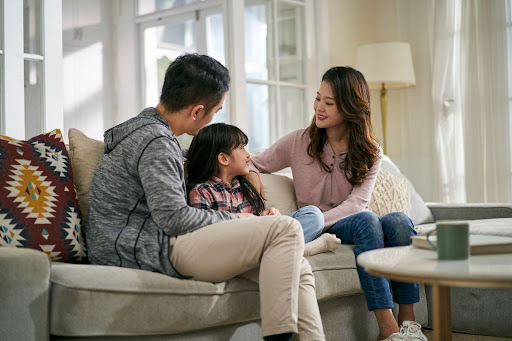 Parents talking to their kid.