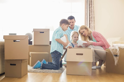 A family packing boxes together.