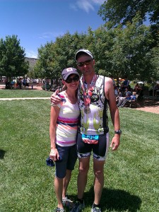 a runner and his wife standing next to each other