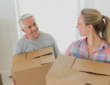 couple moving boxes together