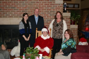 Wheaton representatives with Mrs. Claus. She had story time with the children that are staying at RMH.