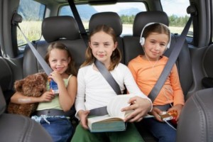 kids buckled in the backseat of a car