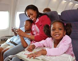 family sitting together on an airplane