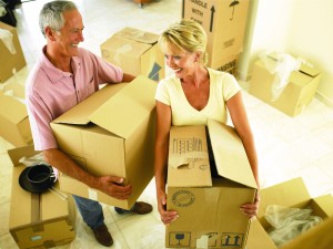 couple moving boxes together