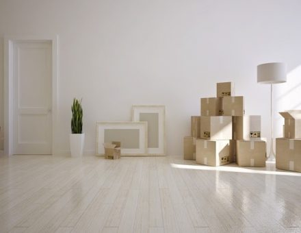 moving boxes piled in empty room