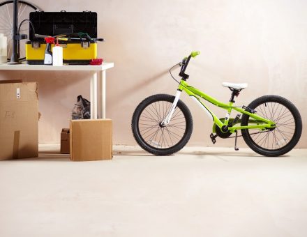 green bicycle in empty garage