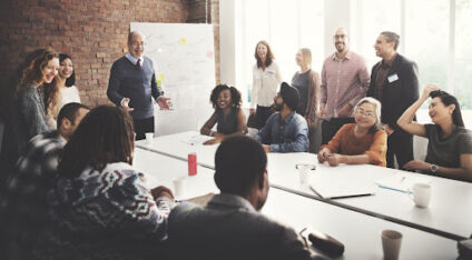 People sitting around an office table.