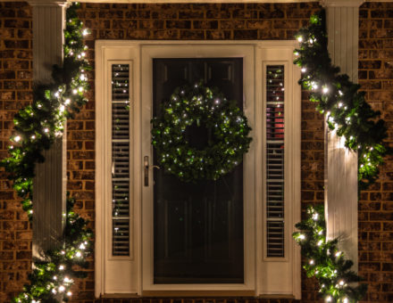 Christmas lights on the front of a building during the holiday season