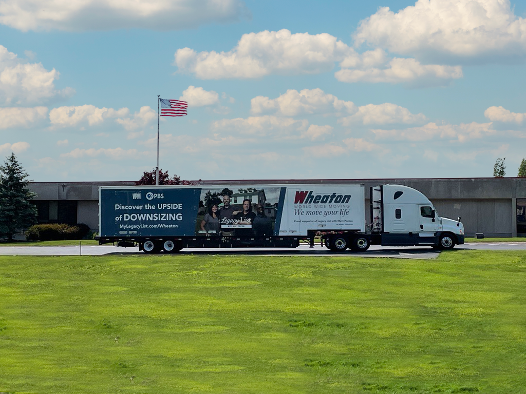 Wheaton World Wide Moving trailer in front of the company's headquarters in Indianapolis, Ind., featuring Emmy-nominated Public Television show Legacy List with Matt Paxton's cast