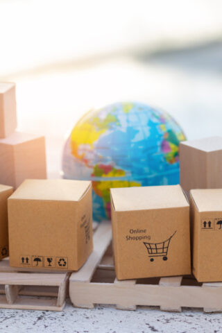 Boxes next to a globe.