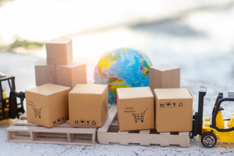 Boxes next to a globe.