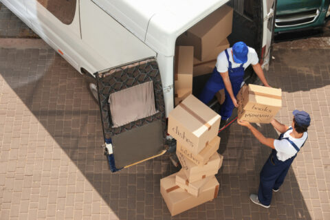 Movers unloading boxes.