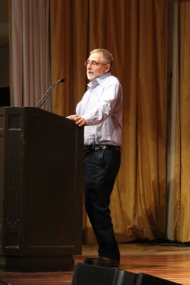 man giving a speech on stage