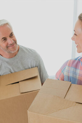 couple moving boxes together