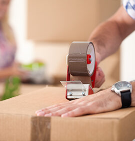 packing a box with tape