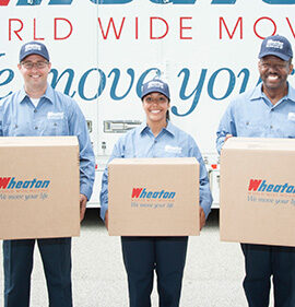 Wheaton employees holding moving boxes