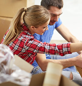 couple assembling furniture together