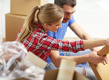 couple assembling furniture together