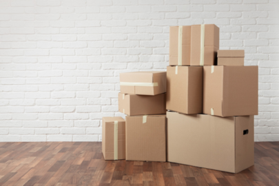 Stack of cardboard boxes in the empty room