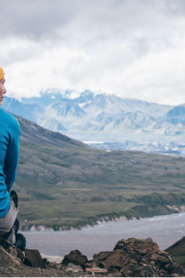 Woman sitting on a mountain