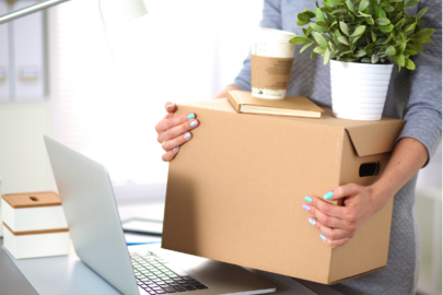 woman packing up belongings to move offices