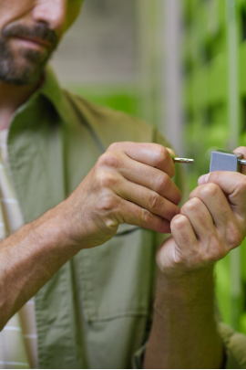 man inserting key into storage unit lock