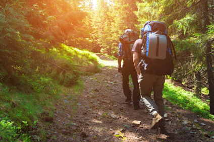 Two people hiking on a trail.