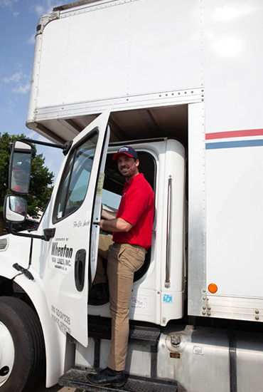 A Wheaton driver climbing into his truck.