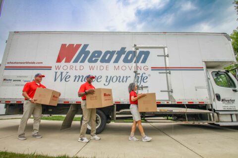 Wheaton movers in front of a Wheaton truck.