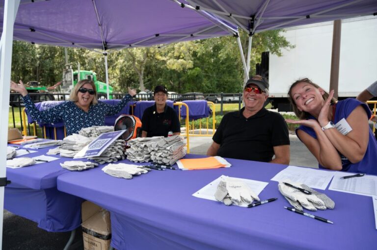 Central Moving & Storage volunteers await Florida truck pull participants at registration table