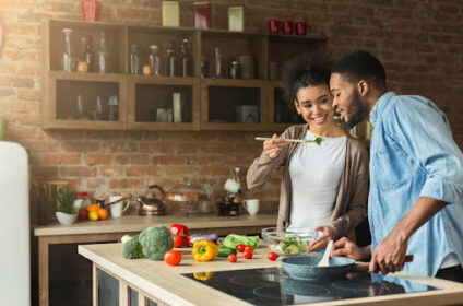 A couple cooking together.