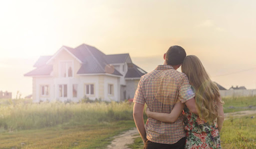 A couple looking at a house.