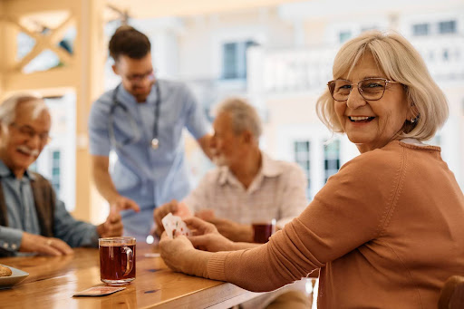 An elderly woman smiling at the camera.