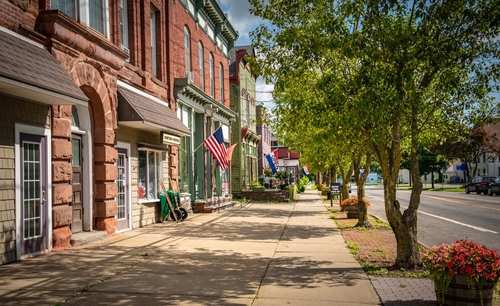 A small town main street with storefronts.